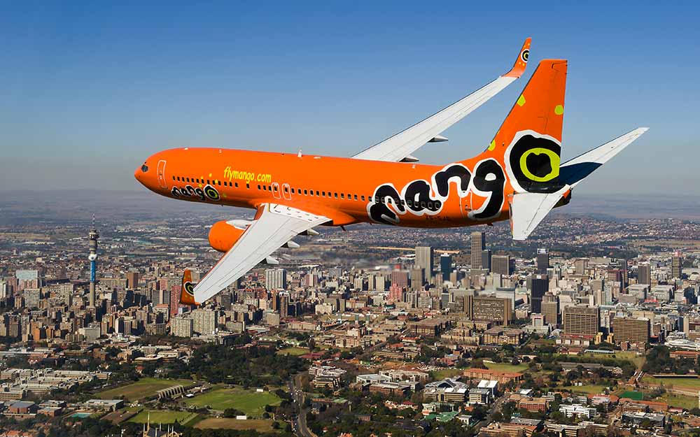 enkosi-africa-safari-mango-airlines-plane-over-johannesburg